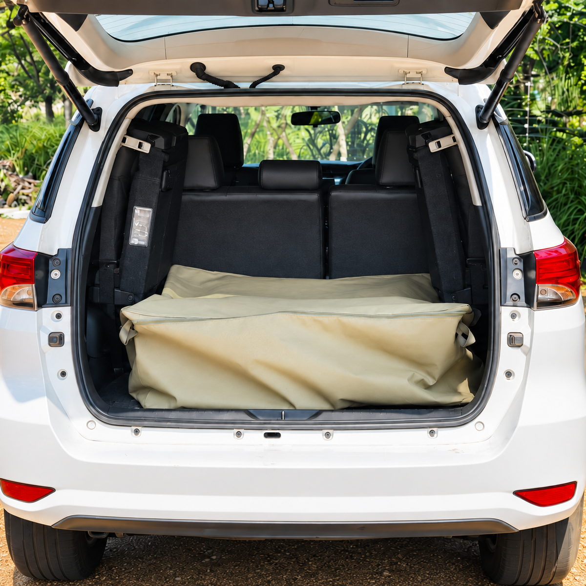 Khaki SUV Bag in the open load area of a white SUV